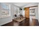 Bedroom sitting area with a barn door that leads into the bathroom and nice hardwood floors at 8783 S Carr Way, Littleton, CO 80128