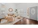 Cozy living room with hardwood floors, white walls, and comfortable seating at 8783 S Carr Way, Littleton, CO 80128