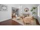 Open-concept living room with elegant decor and a view into the dining area at 8783 S Carr Way, Littleton, CO 80128