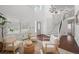 Bright living room featuring high ceilings, modern furniture, and natural light at 8783 S Carr Way, Littleton, CO 80128