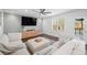 Cozy living room featuring a large window, modern furniture, and hardwood floors at 8783 S Carr Way, Littleton, CO 80128