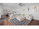 Open living room with a comfortable white sectional sofa and stylish decor at 8783 S Carr Way, Littleton, CO 80128