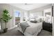 Serene bedroom with a balcony, mountain views, and plenty of natural light, ideal for relaxation and rejuvenation at 2620 S Delaware St # 3, Denver, CO 80223