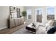 Cozy living room with stylish console, modern decor, and lots of natural light with a door leading to a balcony at 2620 S Delaware St # 3, Denver, CO 80223