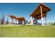 Modern park pavilion featuring architectural rooflines and picnic tables at 2620 S Delaware St # 3, Denver, CO 80223