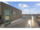 Expansive roof deck with tile flooring, offering amazing views of the surrounding city and landscape at 2620 S Delaware St # 3, Denver, CO 80223