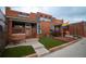 Cozy grooming shop front with rainbow flag and well-maintained landscaping at 2620 S Delaware St # 3, Denver, CO 80223