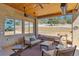 Stylish covered patio with ample seating and views of the spacious backyard at 4619 Mohawk Dr, Larkspur, CO 80118