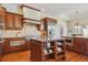 Spacious kitchen with custom cabinets, granite countertops, stainless steel appliances and island at 4619 Mohawk Dr, Larkspur, CO 80118