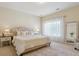 Bright main bedroom featuring plush carpeting, neutral walls, and large windows with sheer curtains at 4619 Mohawk Dr, Larkspur, CO 80118
