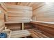 Relaxing home sauna features wood paneling and multiple benches for a luxurious experience at 4619 Mohawk Dr, Larkspur, CO 80118