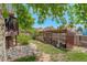 A backyard featuring a covered chicken coop and patio at 12671 Meadow Bridge Way, Parker, CO 80134