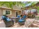 Backyard patio seating area featuring stylish outdoor furniture and a fire pit at 12671 Meadow Bridge Way, Parker, CO 80134