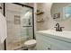 Bathroom featuring a walk-in shower with black hardware and stylish decor at 12671 Meadow Bridge Way, Parker, CO 80134
