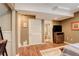 Bedroom featuring a television and desk with an en suite bathroom at 12671 Meadow Bridge Way, Parker, CO 80134