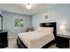 Cozy bedroom with natural light, dark furnishings and neutral colored walls at 12671 Meadow Bridge Way, Parker, CO 80134