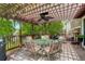 Outdoor deck area featuring a wooden pergola and table with seating at 12671 Meadow Bridge Way, Parker, CO 80134
