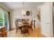 Cozy dining room featuring hardwood floors, a round table, and elegant decor at 12671 Meadow Bridge Way, Parker, CO 80134