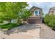 Charming two-story home with a well-manicured front yard and a large driveway at 12671 Meadow Bridge Way, Parker, CO 80134