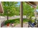 Inviting front porch with a view of the lush green neighborhood at 12671 Meadow Bridge Way, Parker, CO 80134