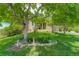 Charming home with mature trees, lush lawn, and well-maintained landscaping at 12671 Meadow Bridge Way, Parker, CO 80134