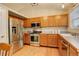 Well-equipped kitchen with stainless steel appliances, plentiful storage, and modern lighting at 12671 Meadow Bridge Way, Parker, CO 80134