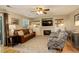 Inviting living room featuring a fireplace, comfortable seating, and stylish decor at 12671 Meadow Bridge Way, Parker, CO 80134