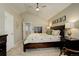 Comfortable main bedroom with a vaulted ceiling, carpet flooring and stylish decor at 12671 Meadow Bridge Way, Parker, CO 80134