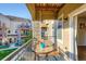 Charming balcony with patio table, offering an outdoor retreat and pleasant community views at 11250 Florence St # 22B, Commerce City, CO 80640
