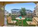 Relaxing balcony view featuring outdoor seating overlooking manicured lawns and townhome exteriors at 11250 Florence St # 22B, Commerce City, CO 80640