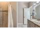 Bathroom showcases a tiled shower, granite countertops, and modern finishes at 11250 Florence St # 22B, Commerce City, CO 80640