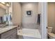 Modern bathroom features a soaking tub, granite countertop, and contemporary design at 11250 Florence St # 22B, Commerce City, CO 80640