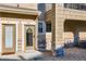 Close up of an entrance featuring two doors with stone veneer and a wreath at 11250 Florence St # 22B, Commerce City, CO 80640