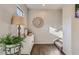 Bright hallway with modern decor, leading to a staircase and other rooms at 11250 Florence St # 22B, Commerce City, CO 80640