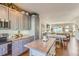Beautiful kitchen with gray cabinets, granite counters, island, and stainless steel appliances at 11250 Florence St # 22B, Commerce City, CO 80640