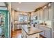 Stylish kitchen featuring gray cabinets, granite countertops, and stainless steel appliances at 11250 Florence St # 22B, Commerce City, CO 80640