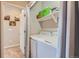 Convenient laundry area featuring a washer and dryer with added shelf for storage at 11250 Florence St # 22B, Commerce City, CO 80640