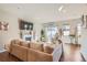 Cozy living room features a fireplace, stylish decor, and lots of natural light at 11250 Florence St # 22B, Commerce City, CO 80640