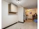 Clean basement area with storage, tile floor, and access to utilities at 1002 S Miller St, Lakewood, CO 80226
