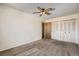 Spacious bedroom with a ceiling fan and standard sized closets at 1002 S Miller St, Lakewood, CO 80226