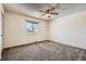 Bedroom featuring a ceiling fan, neutral paint, and ample light at 1002 S Miller St, Lakewood, CO 80226