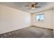 A calm and spacious bedroom featuring a ceiling fan and a bright window at 1002 S Miller St, Lakewood, CO 80226