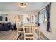 Dining room features a dining table set and ample natural light at 1002 S Miller St, Lakewood, CO 80226