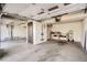 Spacious garage with high ceilings, storage, and natural light at 1002 S Miller St, Lakewood, CO 80226