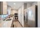 Modern kitchen with stainless steel appliances and bright lighting at 1002 S Miller St, Lakewood, CO 80226