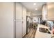 Kitchen with stainless appliances, ample cabinets, and view to dining room at 1002 S Miller St, Lakewood, CO 80226