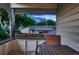Secluded balcony provides a peaceful view of the backyard and surrounding trees at 5611 W Bates Ave, Denver, CO 80227