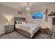 Comfortable bedroom with gray walls, a chandelier, and a window at 5611 W Bates Ave, Denver, CO 80227