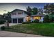 Charming two-story home with a well-manicured lawn and a two-car garage at 5611 W Bates Ave, Denver, CO 80227