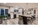A bright kitchen featuring an island with barstool seating at 5611 W Bates Ave, Denver, CO 80227